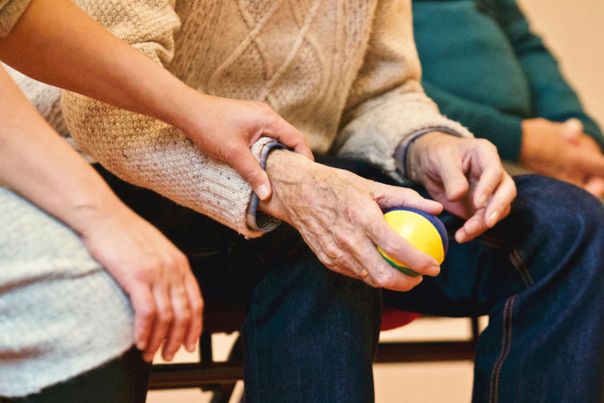 A mental health sufferer using a stress ball